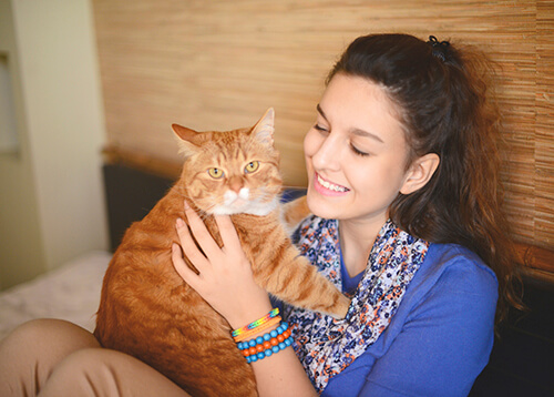 Woman petting her cat